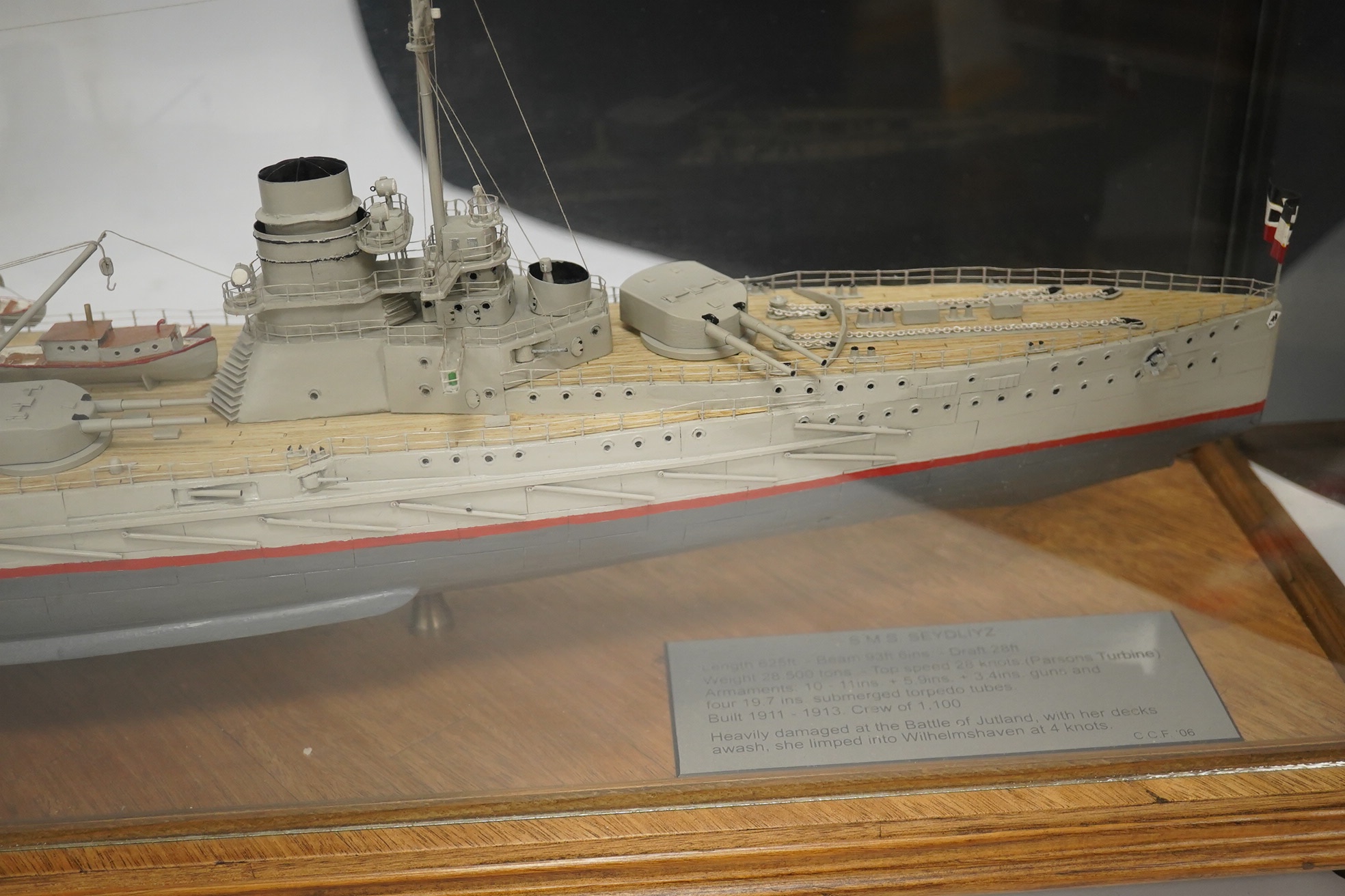 A cased Colin Freeman model of a German battle cruiser, S.M.S. Seydliyz, a well detailed model, with plaque describing the technical details and history regarding her involvement at the battle of Jutland, case 75 x 19.5